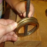 cjbracelets2 Postion the center punch on the inside of the rim.