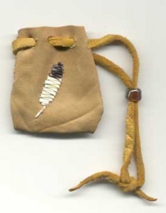 quillclass1 A feather quilled on a leather pouch using the stitches taught in the Porcupine Quillwork Part 2 Class.