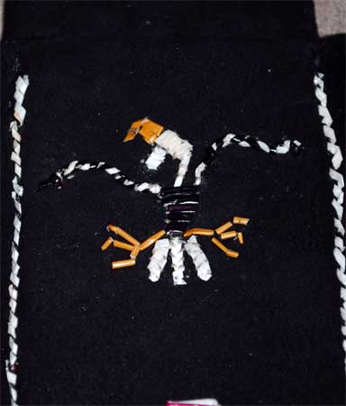 Eagle1 The eagle design is natural and dyed porcupine quills that are embroidered onto black deer skin.